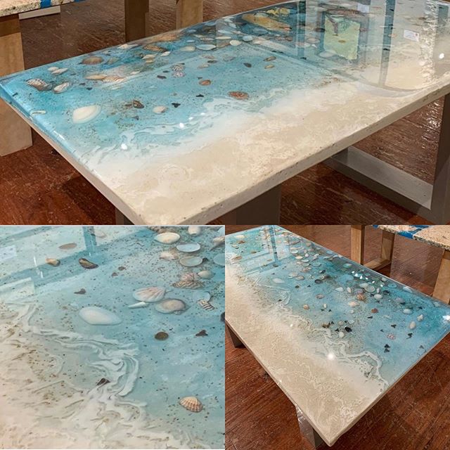Sea shells and sharks teeth bring the look of the beach to artist Larry Anderson&rsquo;s high gloss resin coffee table. Sand and paint complete the shoreline of this magnificent piece.  Side tables, dining room tables or sofa tables are just some ide