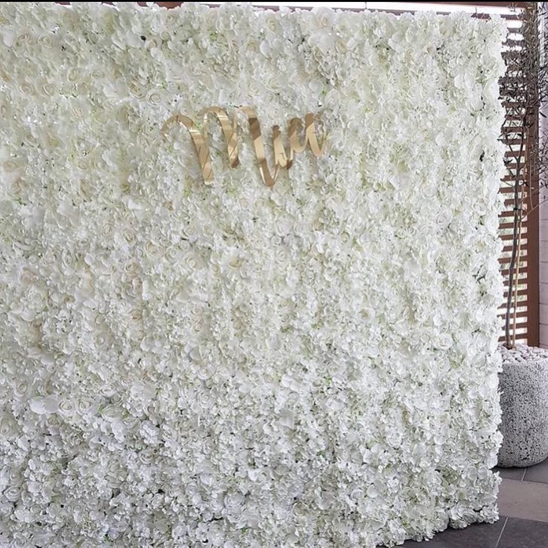 Our white floral wall is perfect for tour event. Contact us today!
