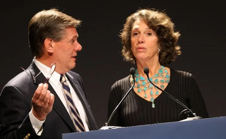 Jim Pringle coaches a keynote speaker at a fundraising gala.
