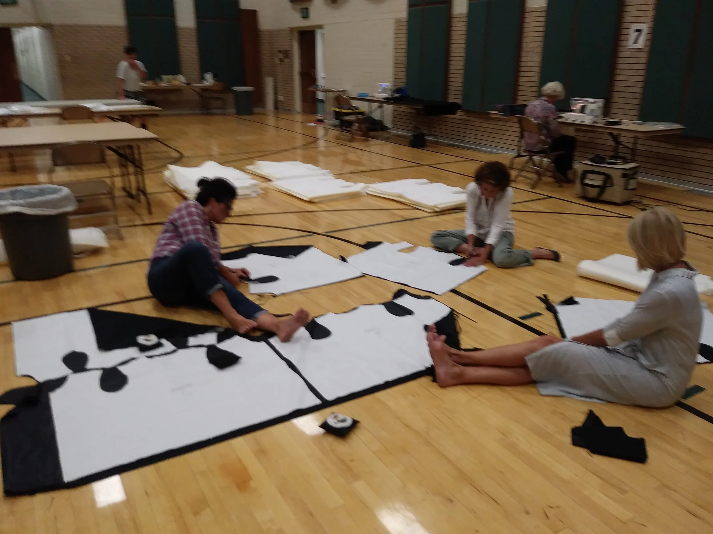 Volunteers cut out vests September 2017
