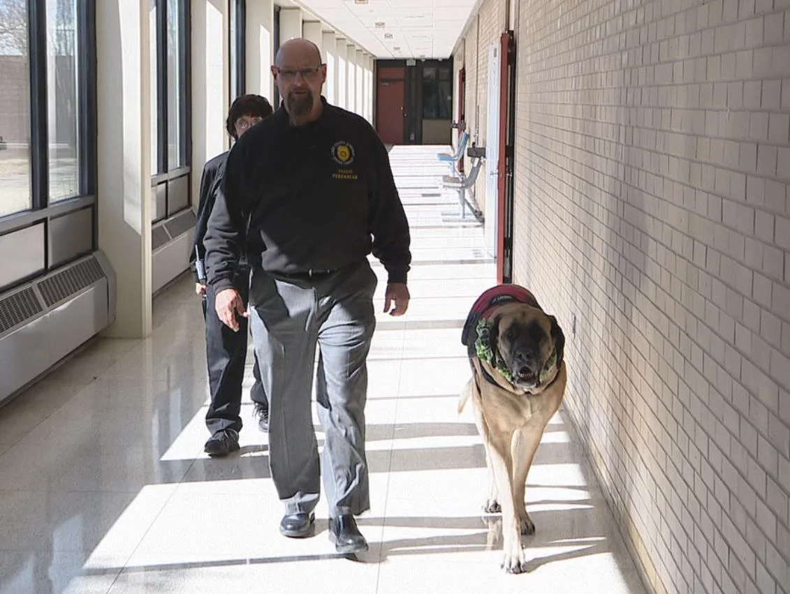Lake County Juvenile Court Senior Judge Thomas P. Stefaniak walks the halls of the Juvenile Center with family pet Moxie.