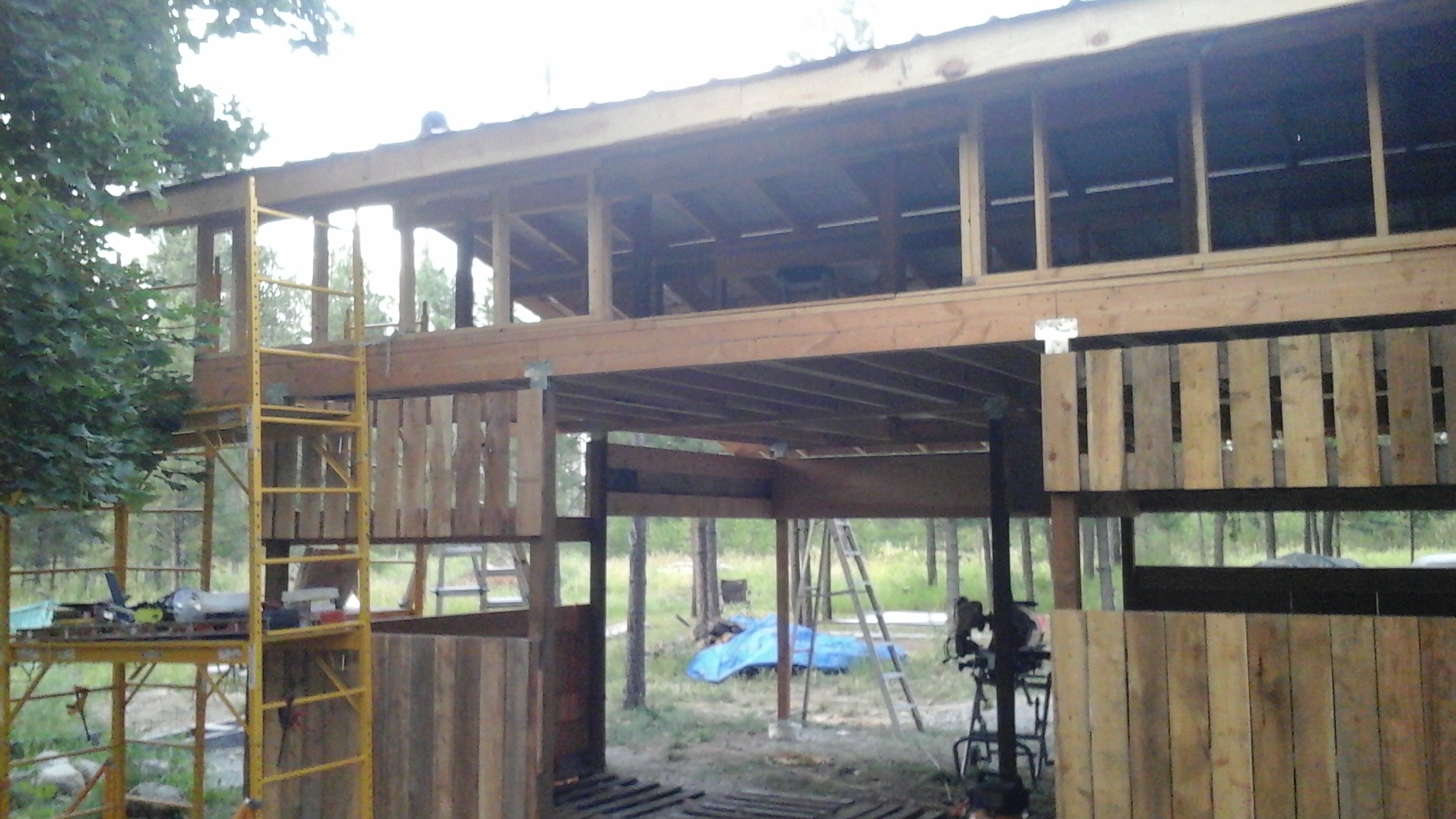 Pole Building Style Open Wood Shed off of shop