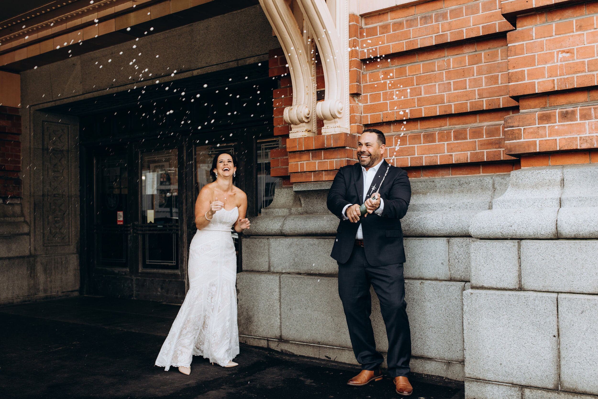 Champagne pop wedding photos