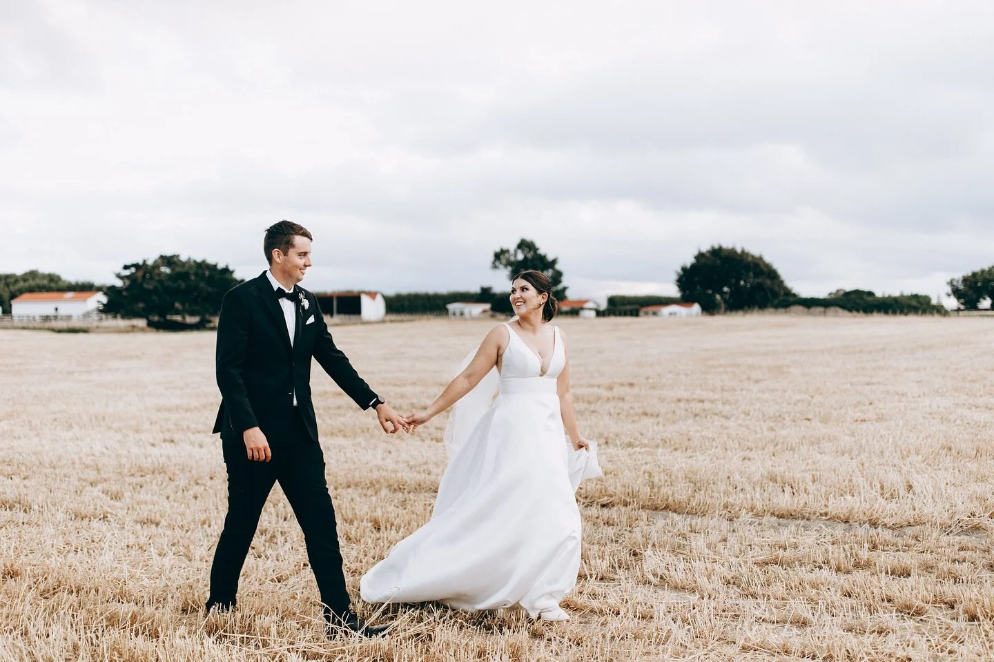 When the best backdrop is just a walk through the fields, hand in hand. 🌾