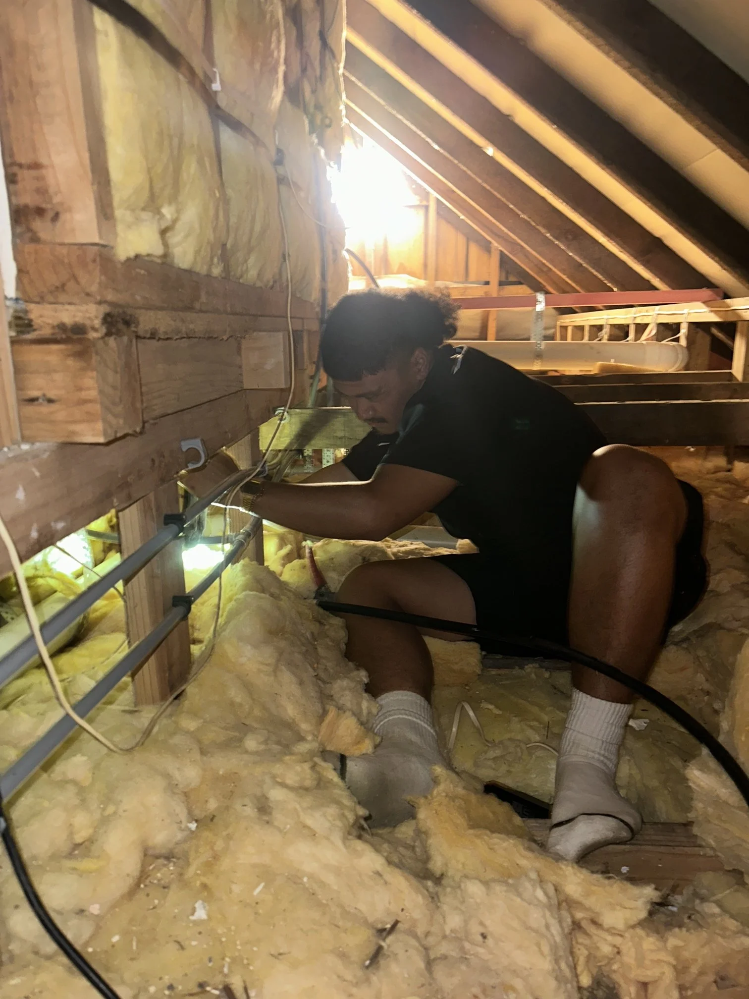 Jack working in the ceiling cavity (1).jpg