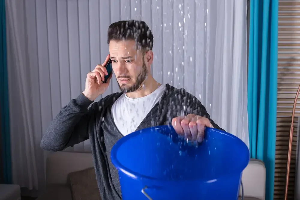 Water leak and bucket