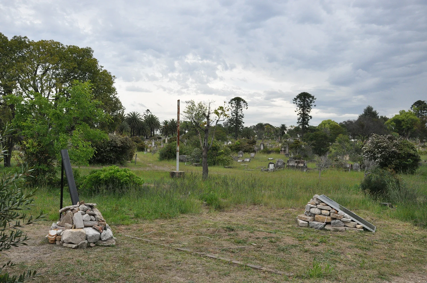  Rebecca Gallo,  Restitution , 2014, rocks, pipe, solar panel, fabric-covered cord, electronic components, video. 