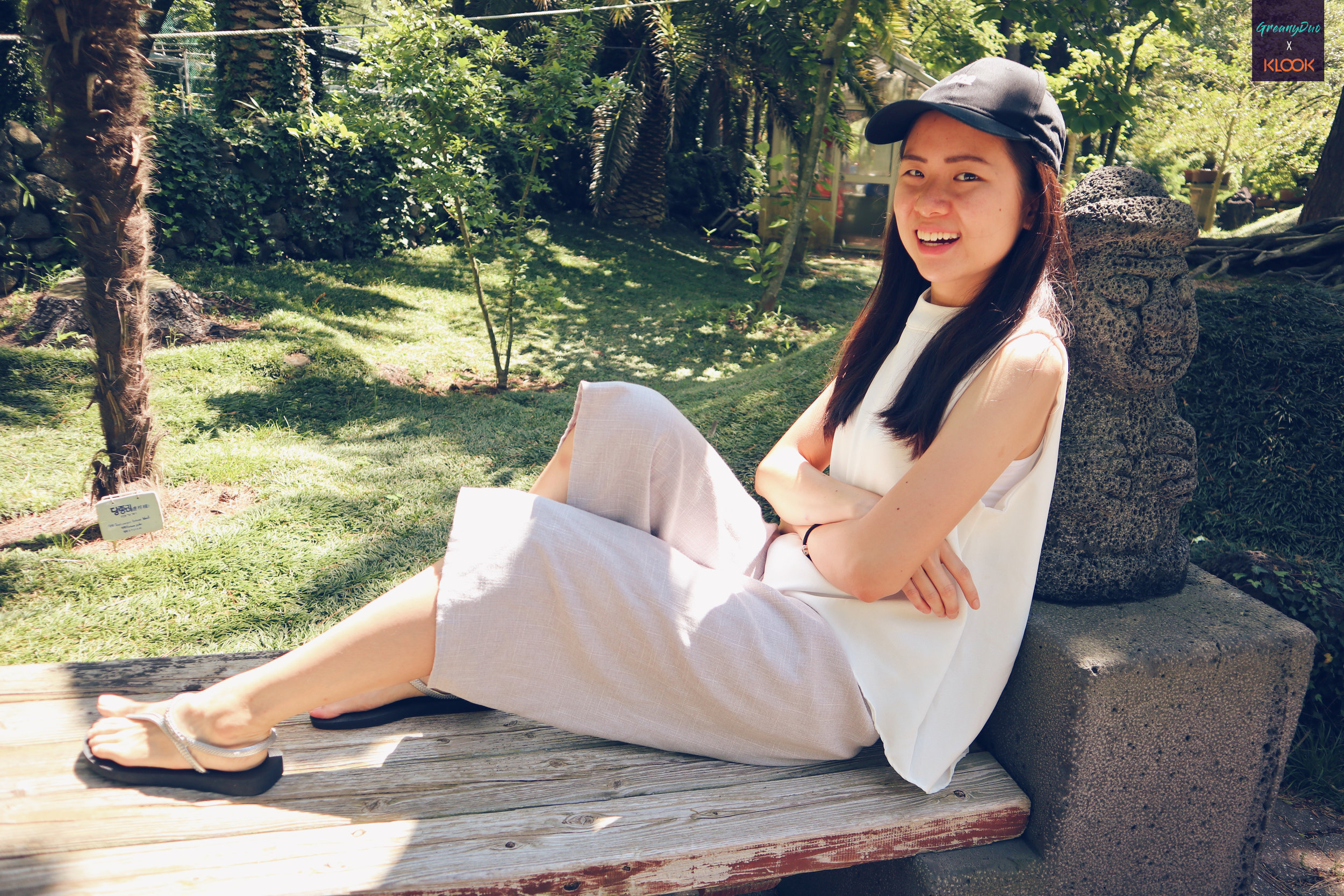 jenny posting on a bench at hallim park, jeju