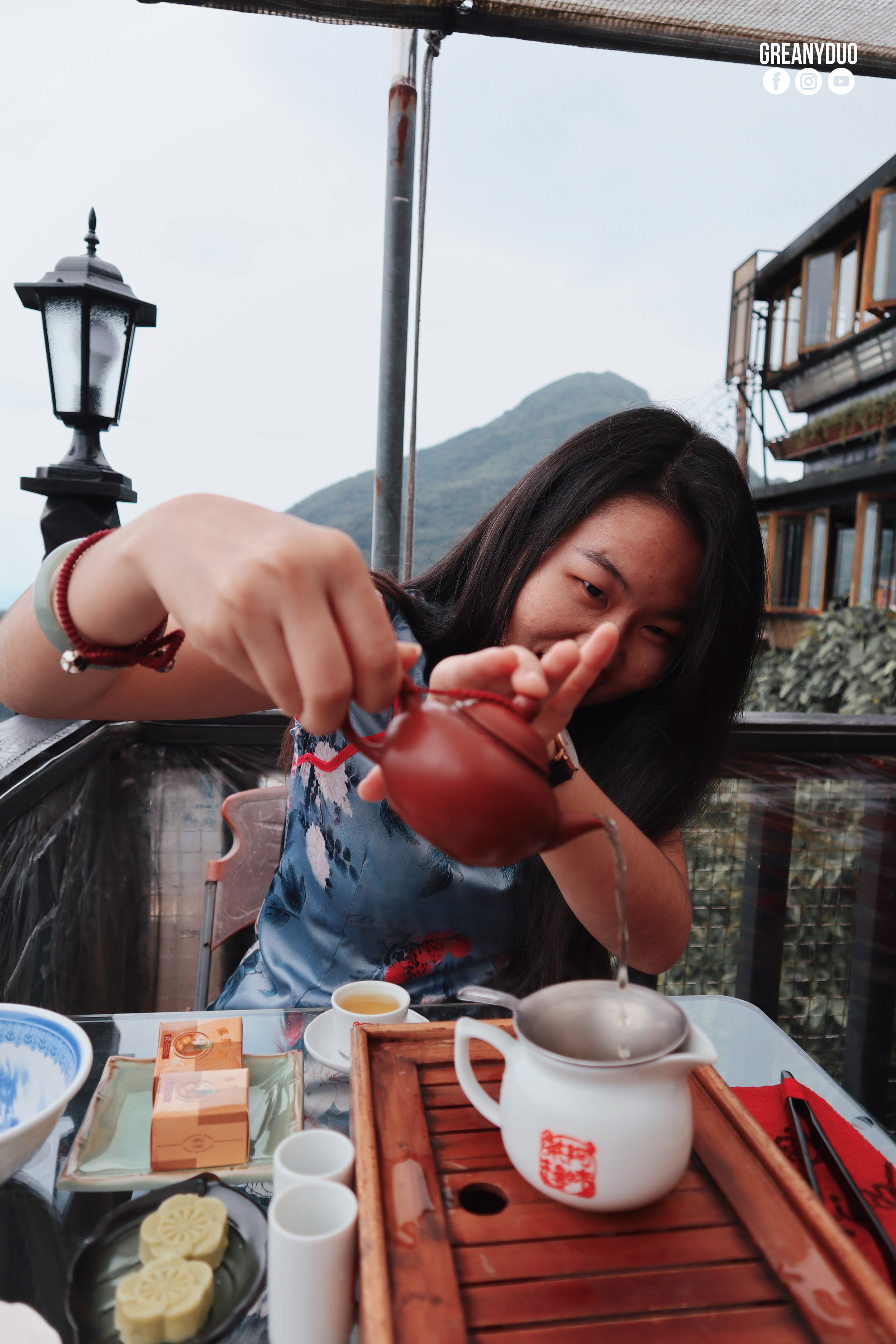 tina drinking tea at Amei Teahouse, jiufen