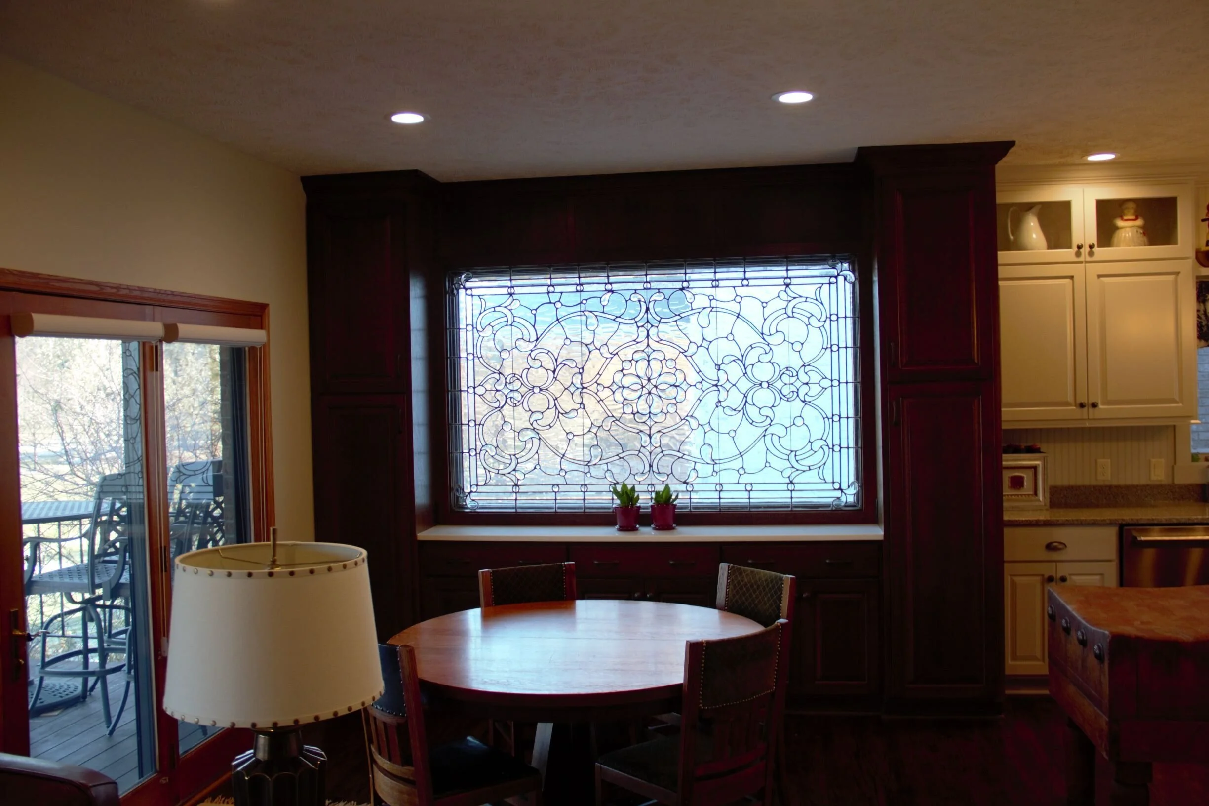  Custom sized window added for owner’s leaded glass panel surrounded by quarter sawn oak custom cabinetry.  