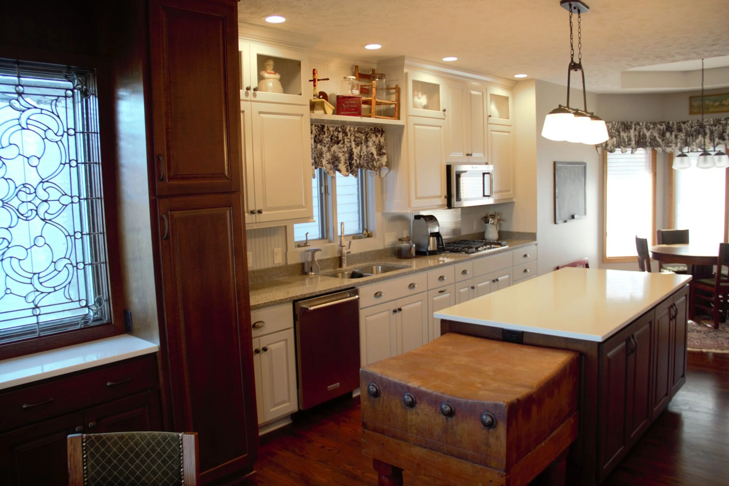  Combining custom painted and quarter sawn oak cabinetry and the owner’s old butcher block.  