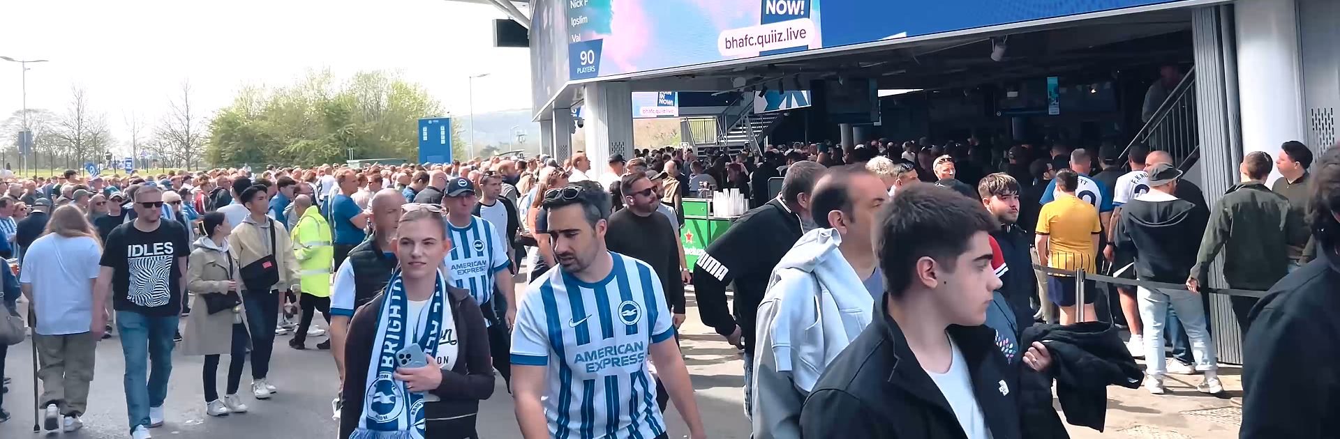 Football fans arriving at a stadium on matchday -- the pre-match window is peak time for fan zone activations