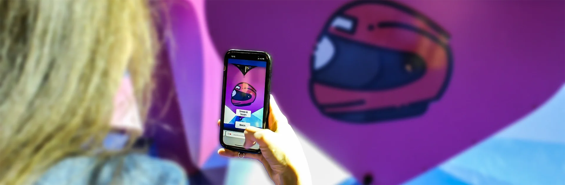 Branded scavenger hunt game on mobile — a player scans a Formula E helmet graphic using AI object recognition during a Quest activation
