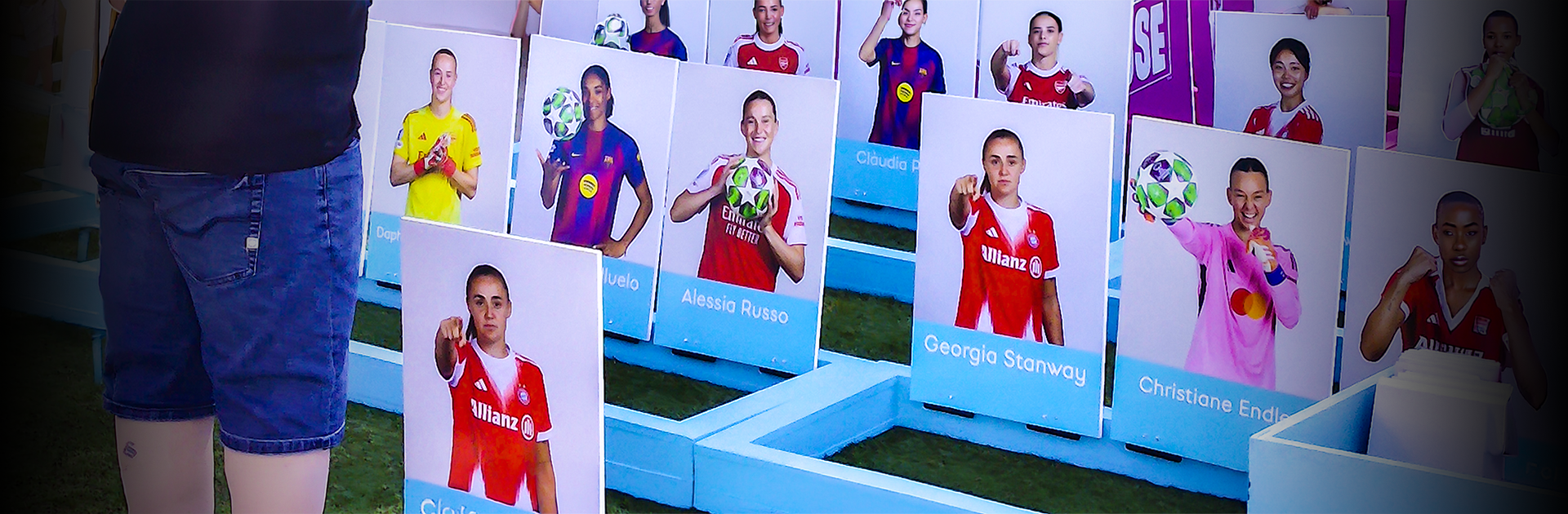 Visitor playing a giant bespoke Guess Who game featuring women's football stars at the 2026 UEFA Women's Champions League Final fan festival in Oslo, Norway.