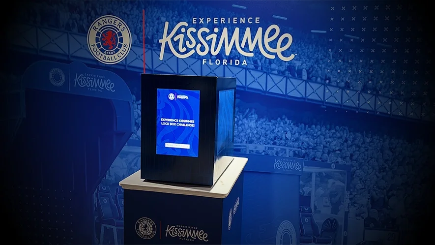 Lockbox activation at Rangers FC fan engagement event — Experience Kissimmee Florida branded competition stand