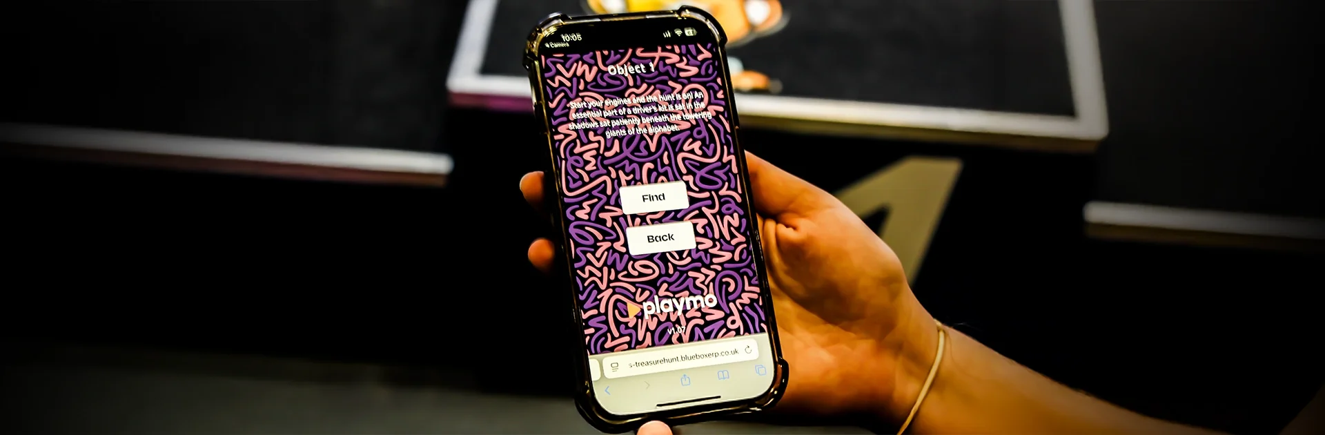 Interactive scavenger hunt hire UK — Quest clue screen on a player's phone at the 2025 Formula E fan village in London