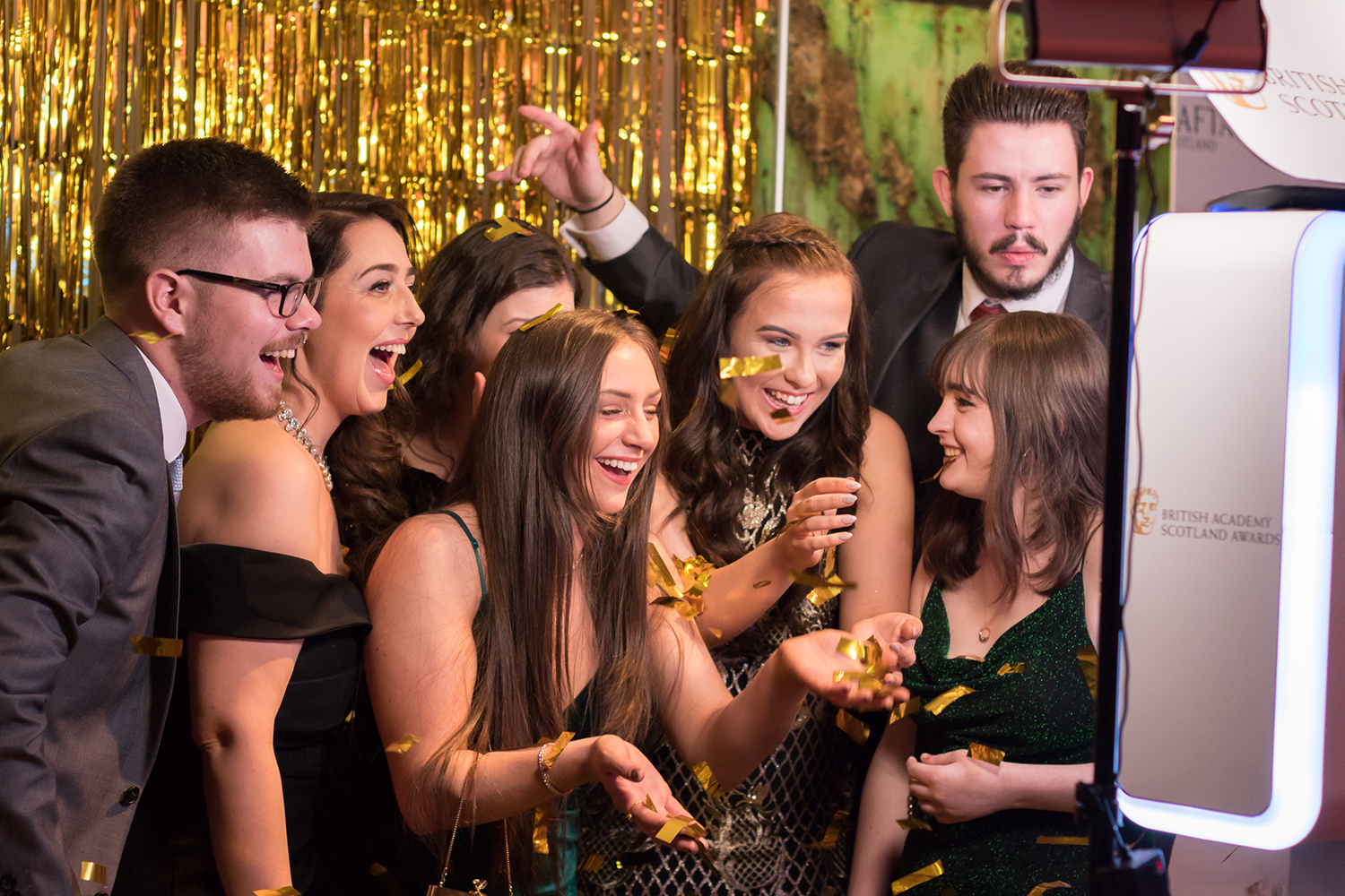 Group of guests enjoying a branded photo booth at the BAFTA Scotland Awards, Glasgow — photo booth hire by Social Jungle