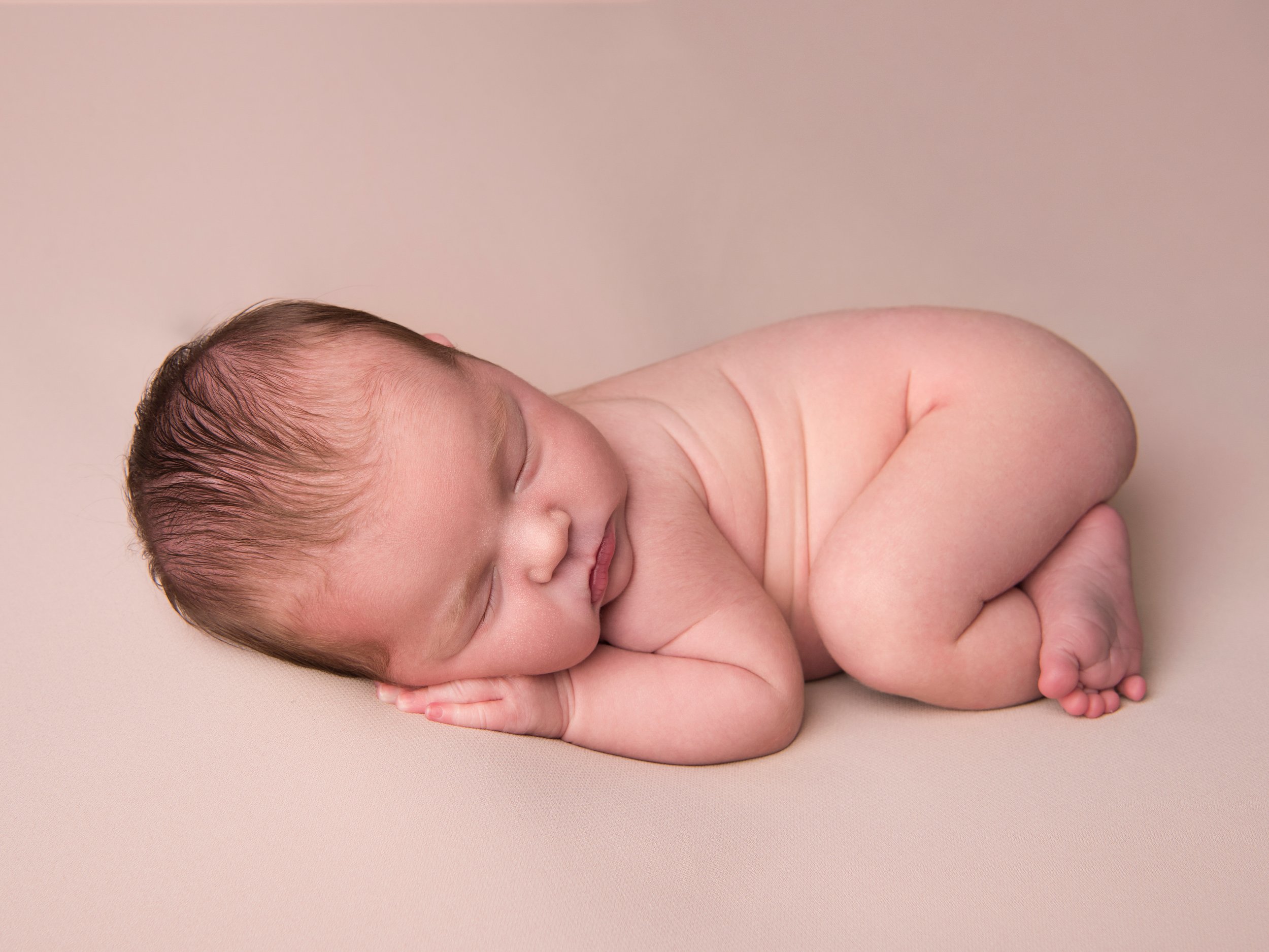 Newborn photography at my studio or at your home.