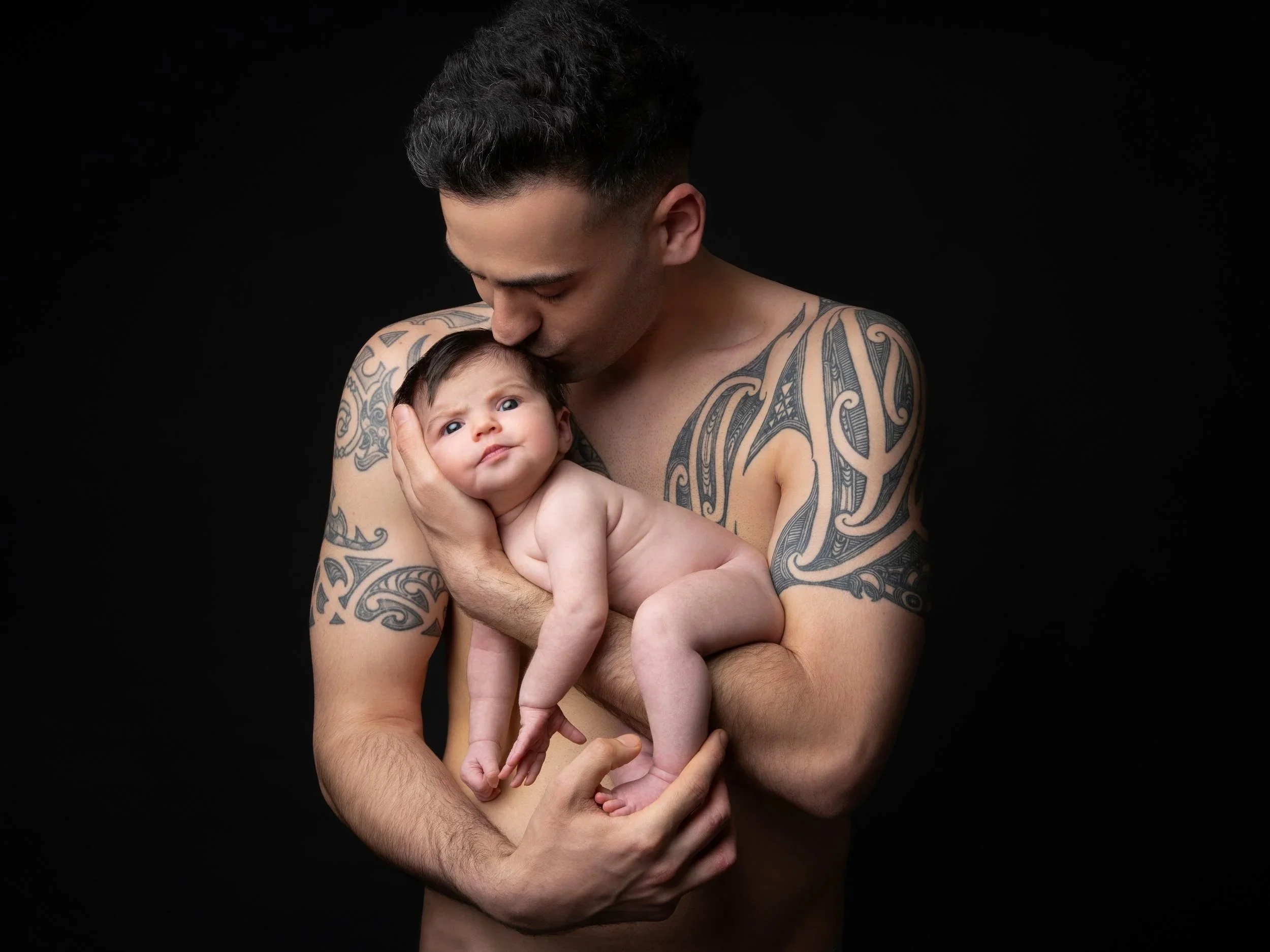 Father and newborn baby skin-to-skin portrait, photographed during an at-home newborn session in London