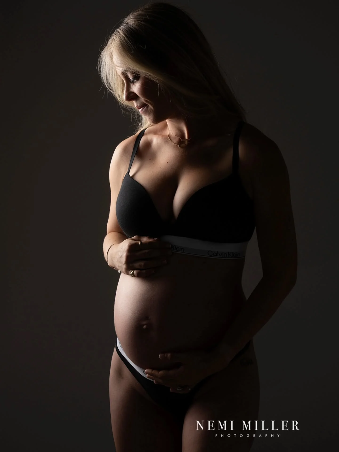 Two beautiful portraits of Naomi from her maternity photoshoot in my West London studio. 🤍

I love these two images, both featuring the timeless simplicity of classic Calvin Klein underwear.

The first is all about atmospheric light, gently drawing 