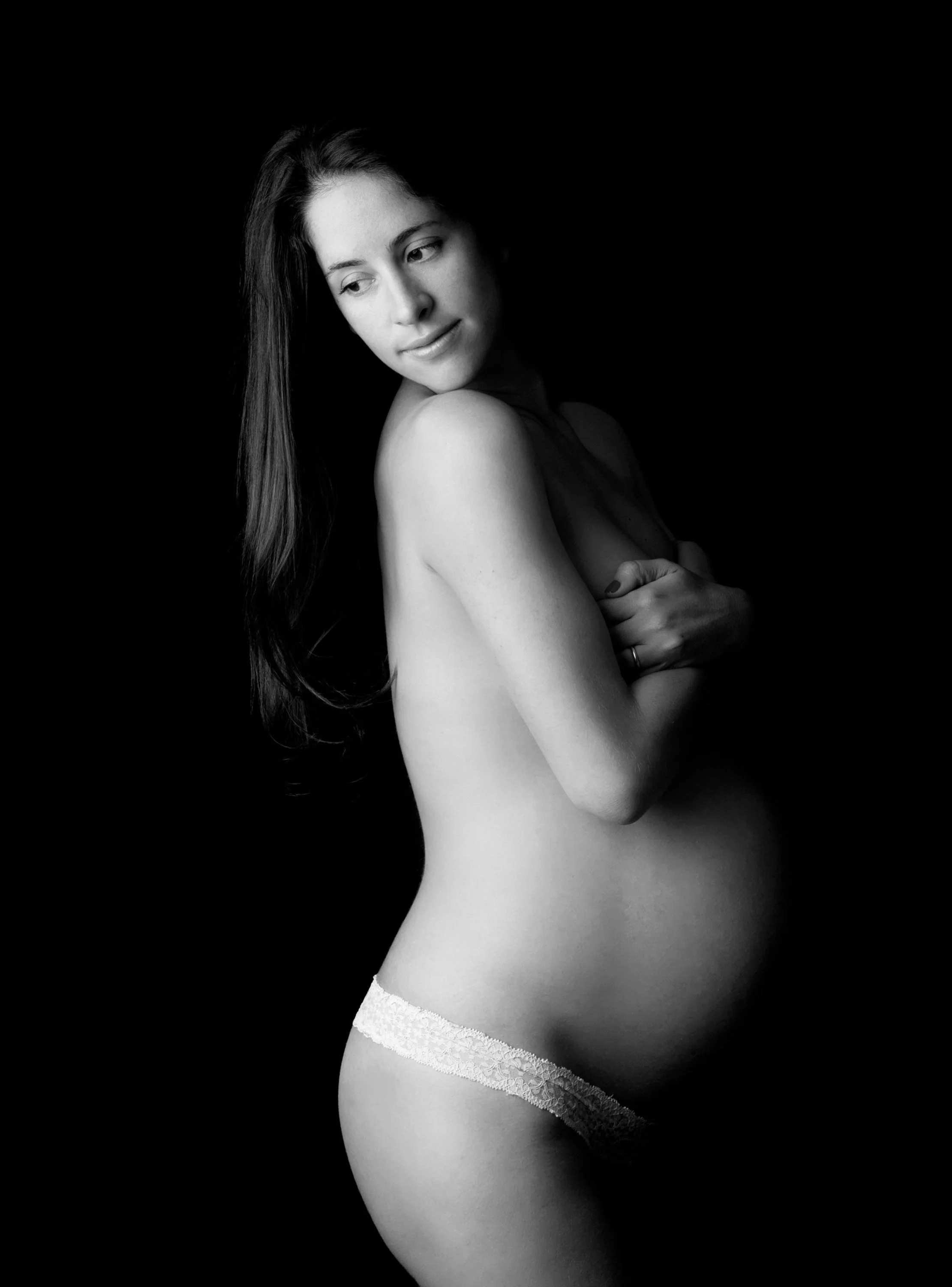 Artistic sexy, nude pregnancy photoshoot by Nemi Miller - a specialist maternity photographer with a West London photography studio.