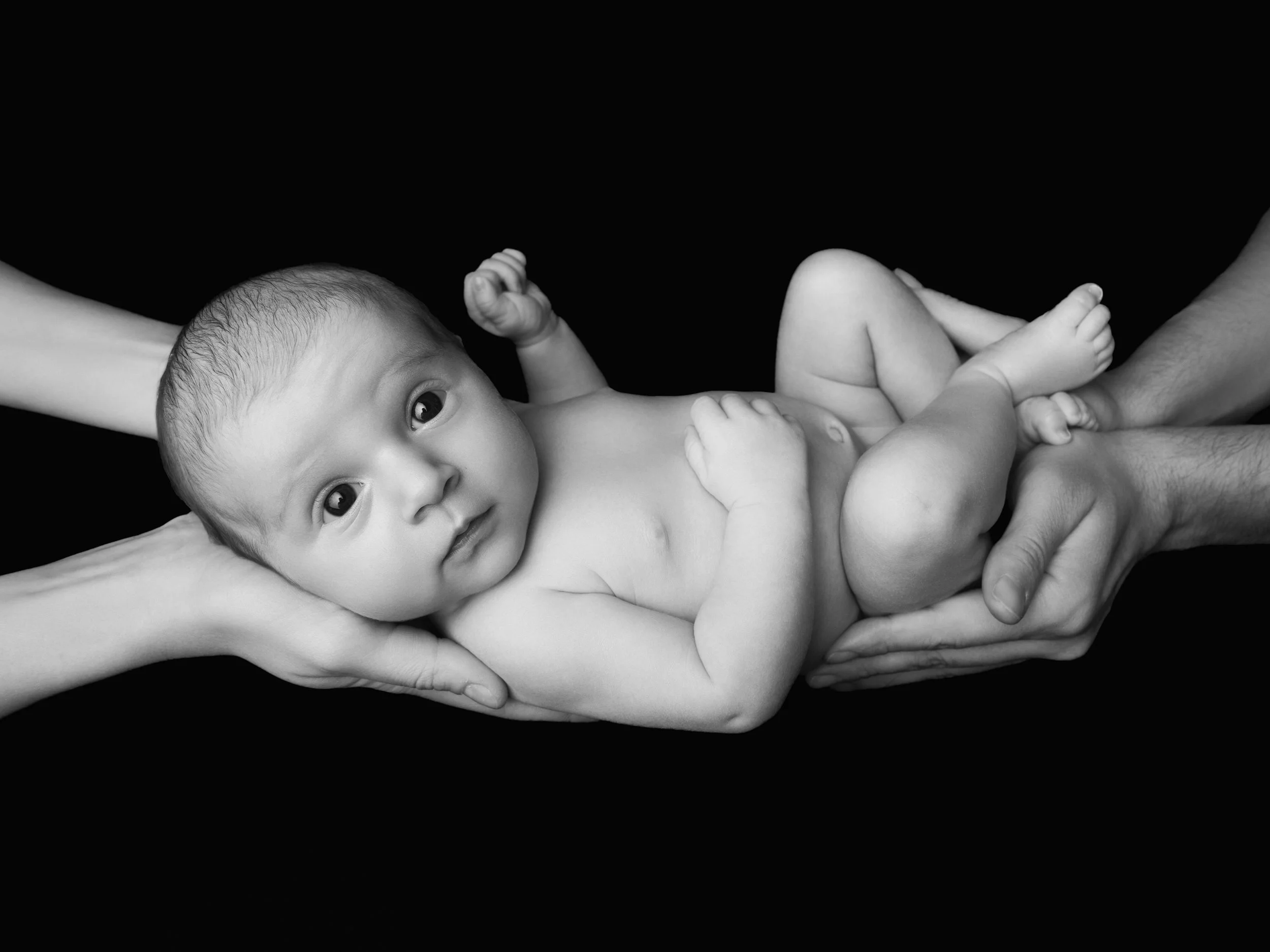 Black and white newborn photography at your home by Nemi Miller, London.