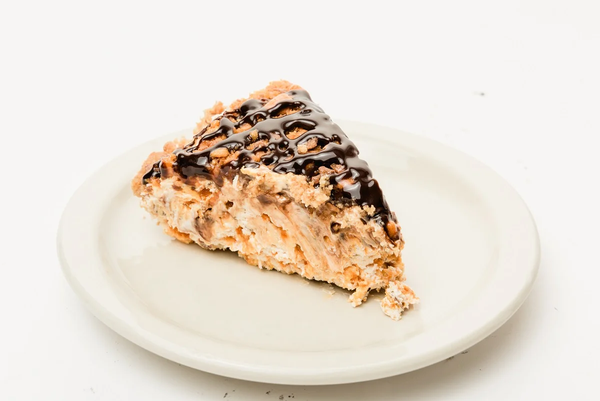 Slice of pie with chocolate drizzle