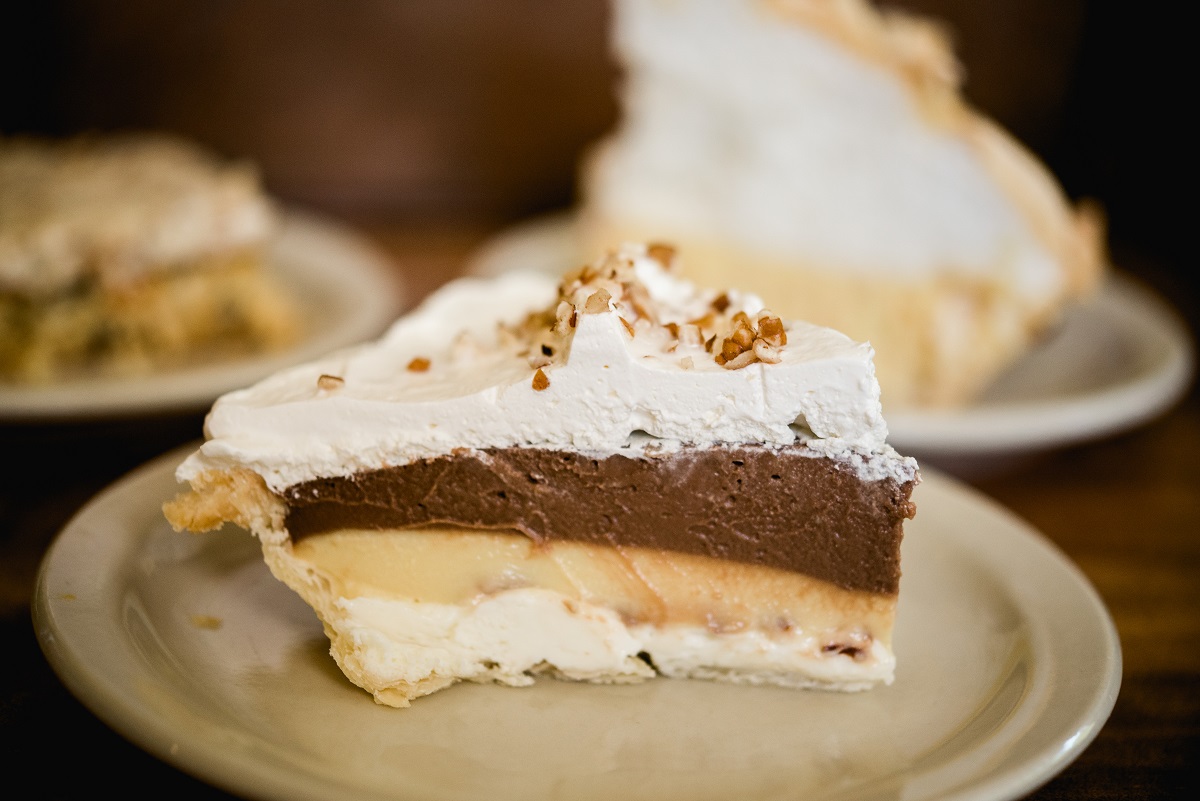 Slice of possum pie topped with pecans