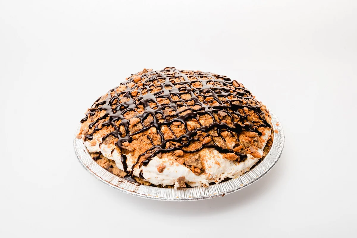Butterfinger pie with chocolate drizzle