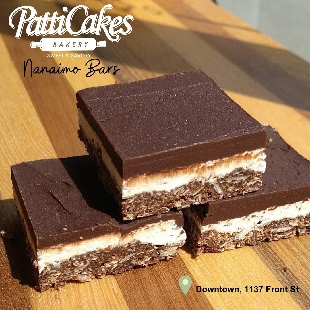 Nanaimo Bars are rich and delicious.  They start with a coconut, graham, and nut crumble base.  Then we layer it with a rich white custard and dark chocolate ganache.  They're only available at our PattiCakes Downtown Location, 1137 Front St.  Just 3