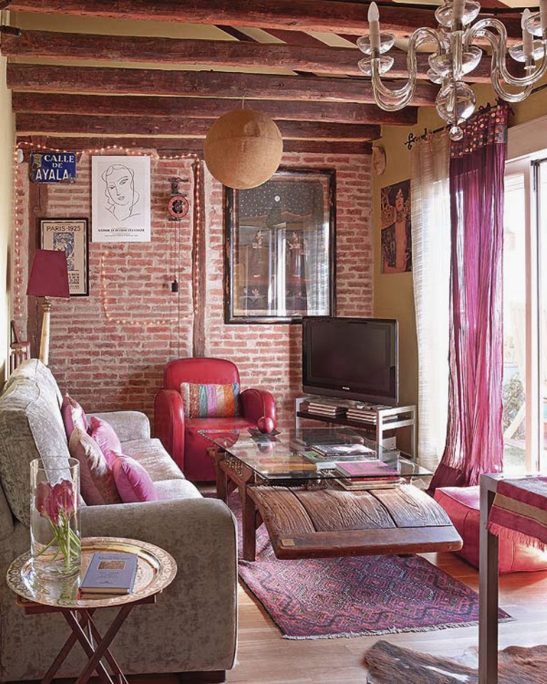 bohemian-living-room-design-with-bright-feminine-bold-color-ideas-and-exposed-brick-wall-decor-and-wooden-roof-beams-and-decorative-ethnic-pattern-accent-with-soft-textures-and-natural-furniture.jpg