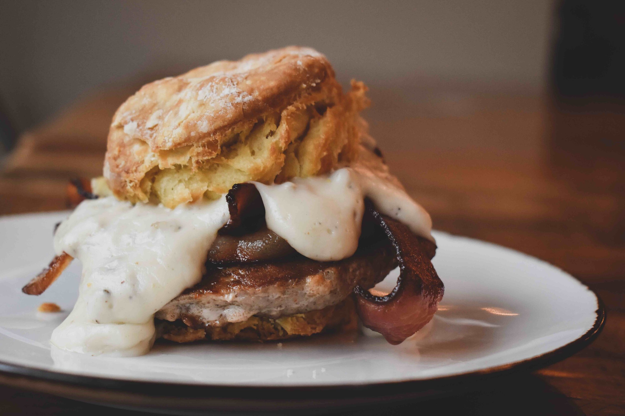 Caboose Tavern meat lovers biscuit breakfast sandwich.jpg