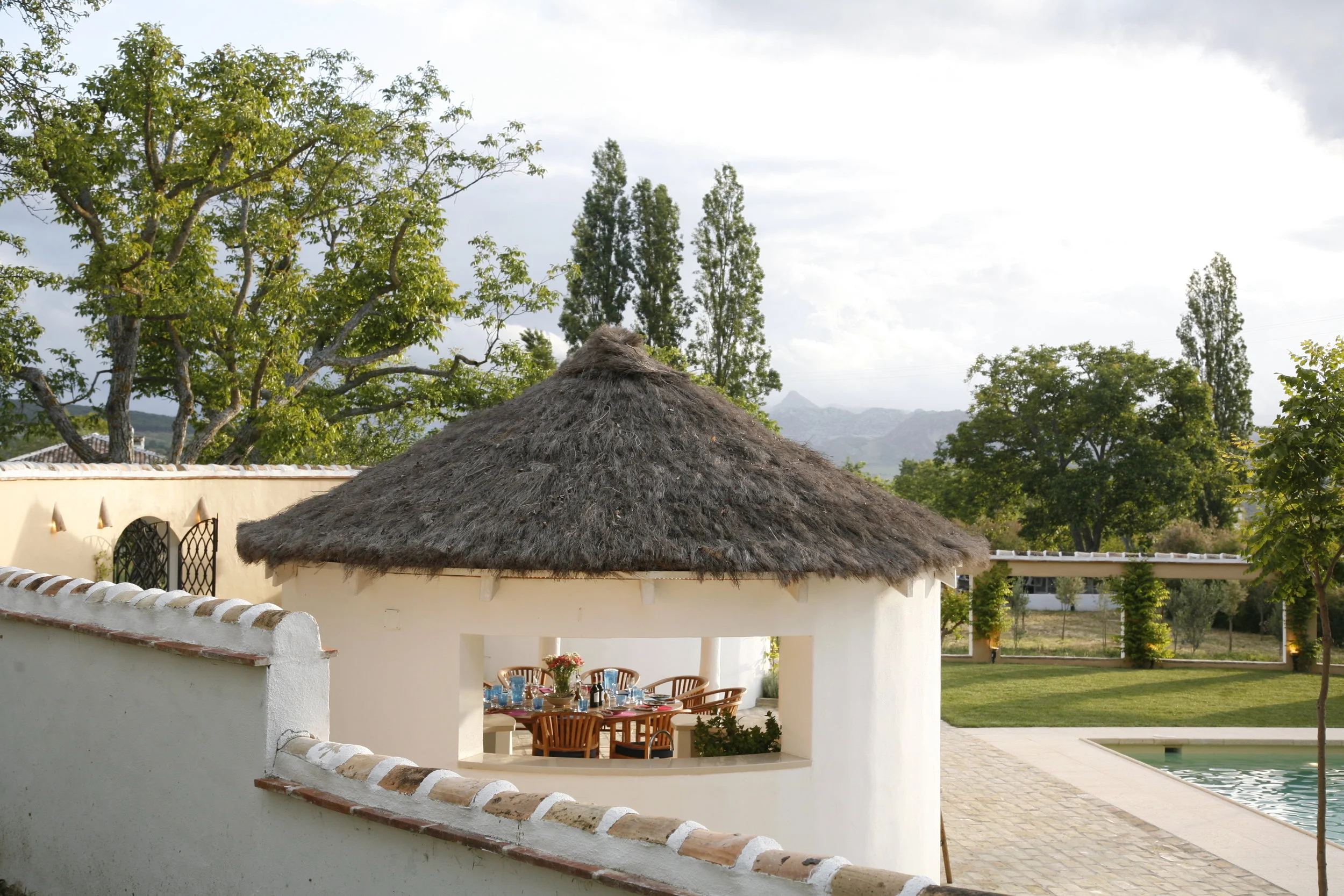 Dining over pool wall.JPG
