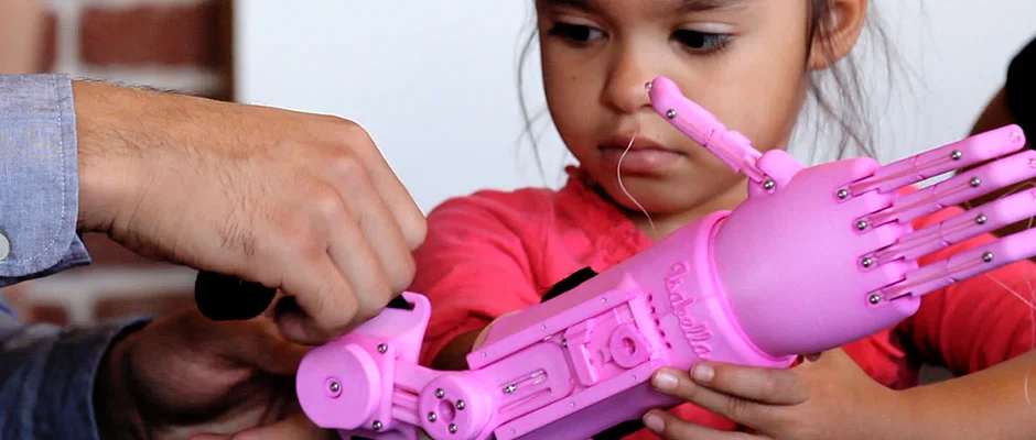PROSTHETIC-Isabella-with-Team-of-Engineer-and-Designers-FATHOM-1.jpg