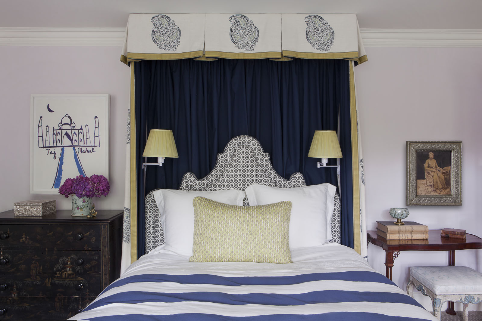  In a guest room, a headboard upholstered in a&nbsp;  Holland &amp; Sherry  textile is framed by bed hangings of&nbsp;  Pintura Studios  &nbsp;and&nbsp;  Loro Piana  &nbsp;fabrics. The sconces are by&nbsp;  Hinson and Co.  , the bedding is by&nbsp;  