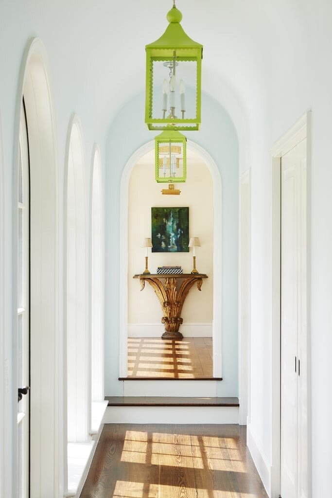  In the hallway of a home on Georgia’s Sea Island, Los Angeles–based interior designer  Kevin Isbell  painted the existing white hanging lanterns a vibrant lime green. Photo by David A. Land 
