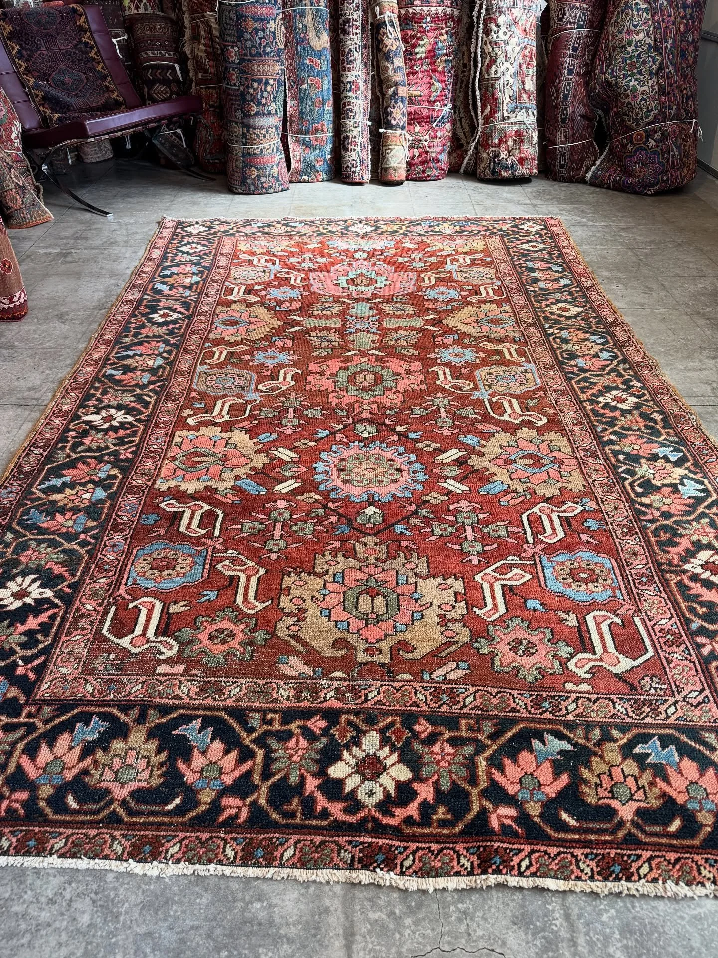 All the goodness you could hope for.
Harshang pattern on a chestnut ground with pops of pale blue, tan, and sage green, framed by a meandering charcoal-blue border. Size is 6&rsquo;2&rdquo;x9&rsquo;3&rdquo; and it was made in the Heriz around between