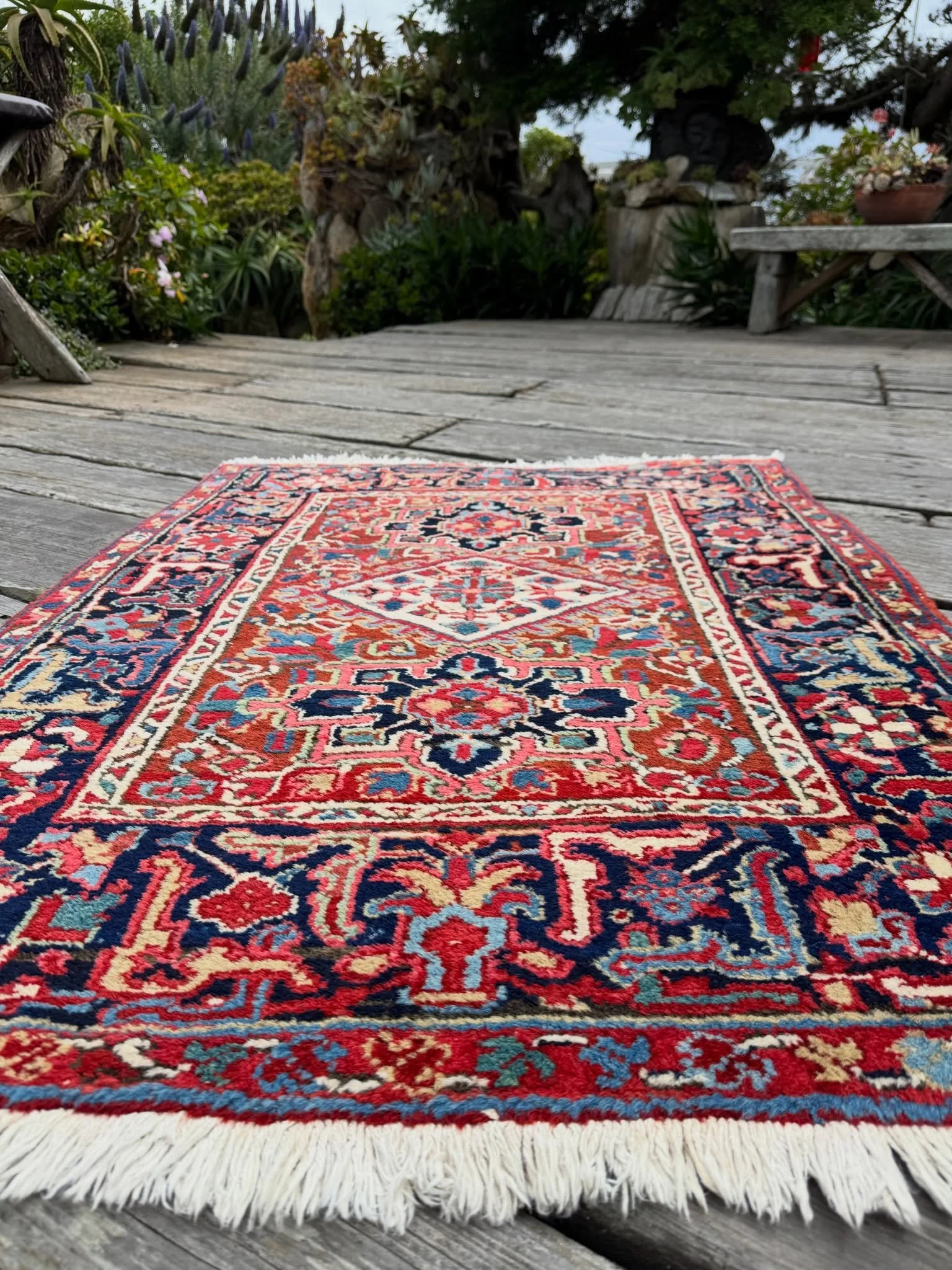 Small but mighty Heriz, and also perfect! 3&rsquo;3&rdquo;x4&rsquo;3&rdquo; of luscious wool and nuanced colors. The main ground is a gorgeous rust with pops of jade green, teal green, sky blue, straw yellow, and navy. Wherever you place this gem, it