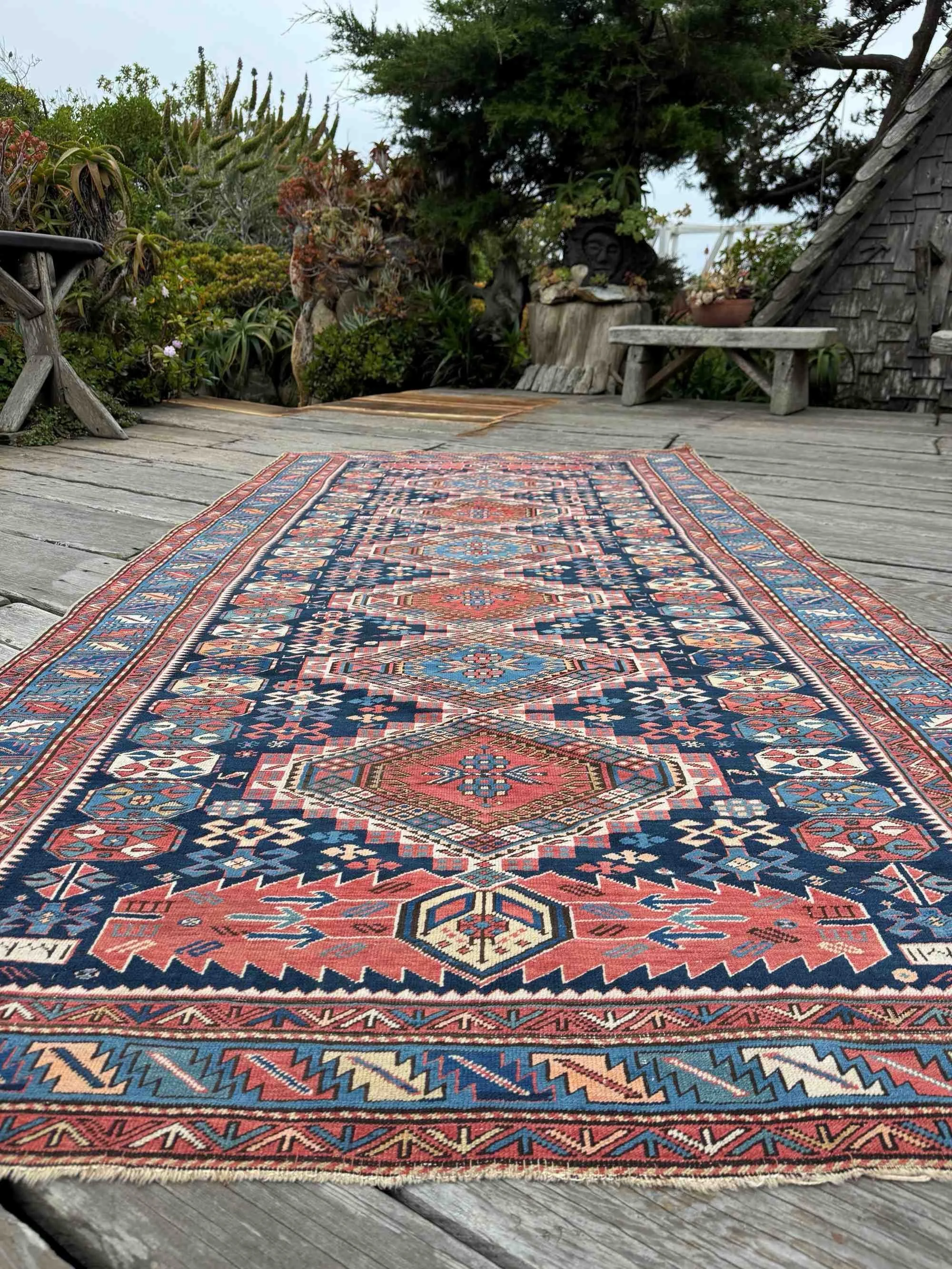 Rug No. 78618

Antique Caucasian Shirvan rug with a sparkling rendition of a well documented design in late 19th century to early 20th century examples from either Shemekha or Arjiman Azerbaijan. Tribal symbols and motifs fill the field around a colu