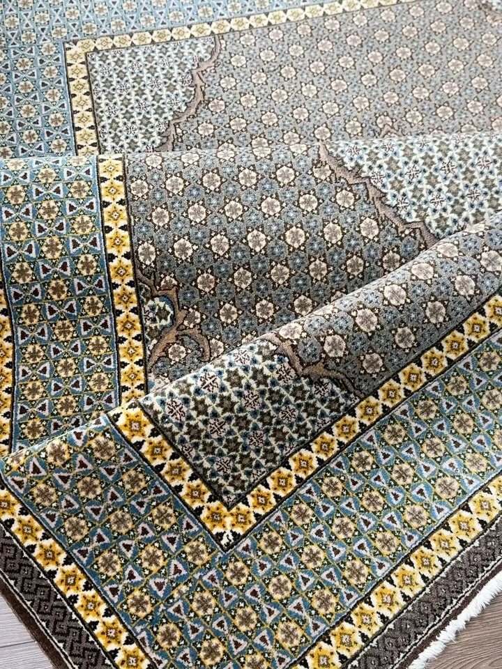 Pure elegance and sophistication. This intricate mosaic pattern is known as kha tam design. The rug itself is a fine quality Moud from the South Khorassan province in eastern Iran. In person it is absolutely entrancing with pure yellow silk highlight
