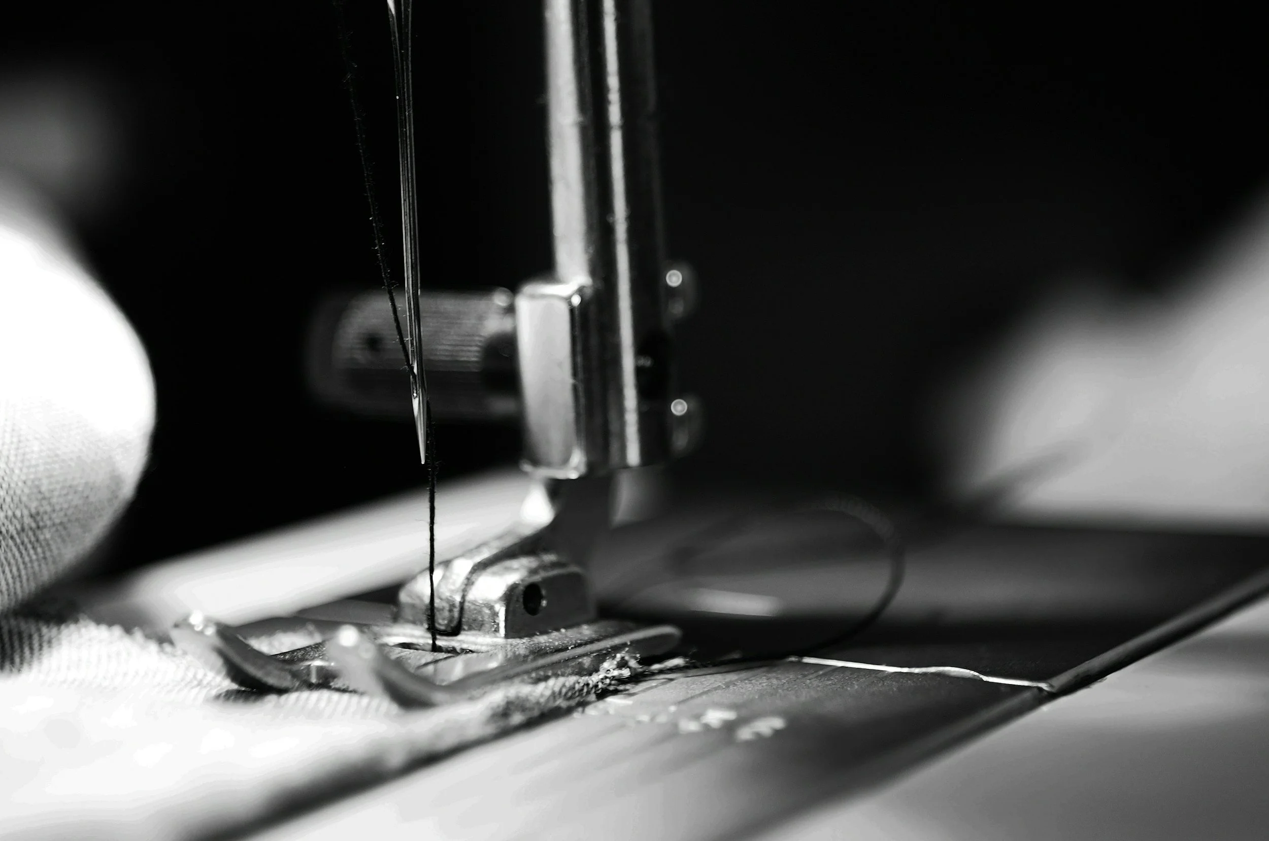 Industrial sewing machine needle stitching heavy fabric