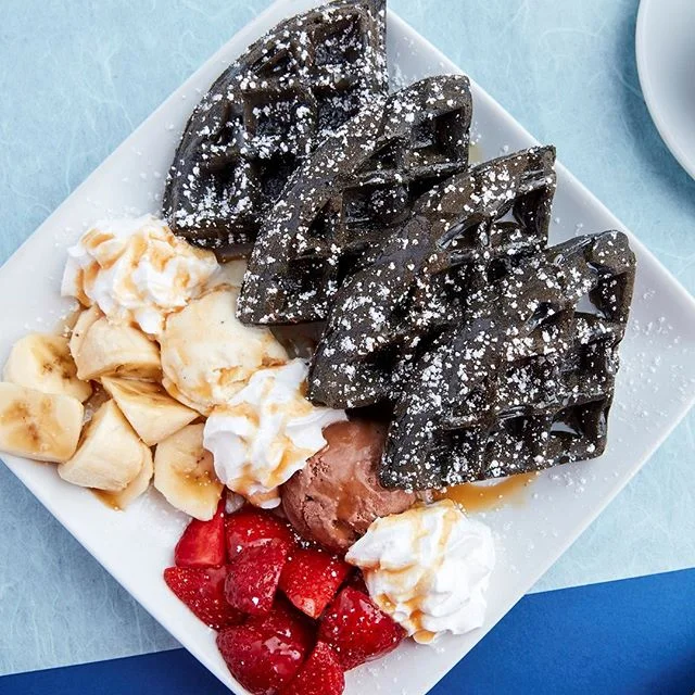 It's always a good time for something sweet! Our Charcoal Waffle is topped with vanilla &amp; nutella ice cream, strawberries, bananas, whipped cream and caramel drizzle. Yum! #gotmacchiato
.
.
.
#coffee #losangeles #la #laeats #yelpla #cafe #food #f