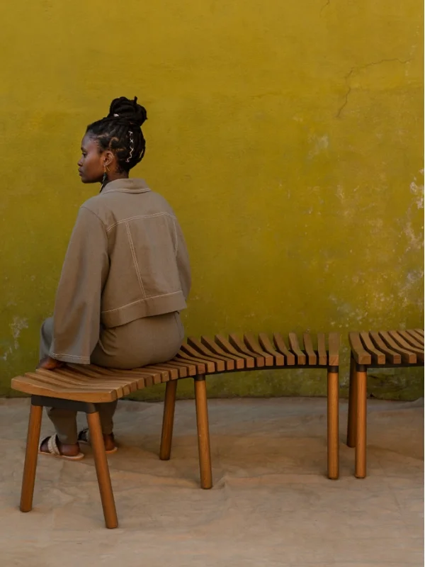 Above: Inspired by the Kenyan ritual of friends pulling up a chair at day’s end to shoot the breeze, the curved solid eucalyptus benches invite close talking. | Source: IKEA
