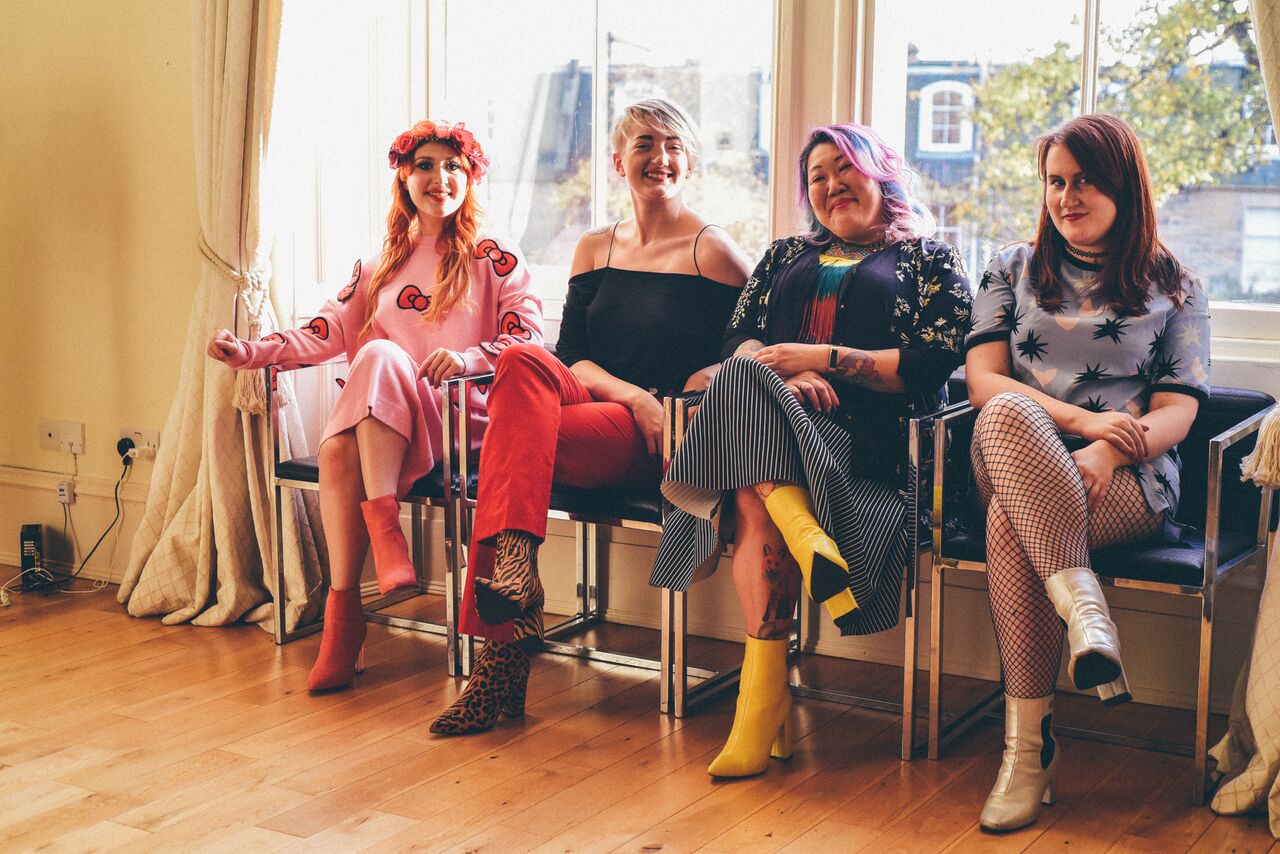 Alice wears Lucie’s dress and boots, Ruth wears Lucie’s top and trousers with Alice’s boots, Lucie wears Ruth’s jacket and Alice’s necklace and boots, Morag wears Alice’s dress and boots.