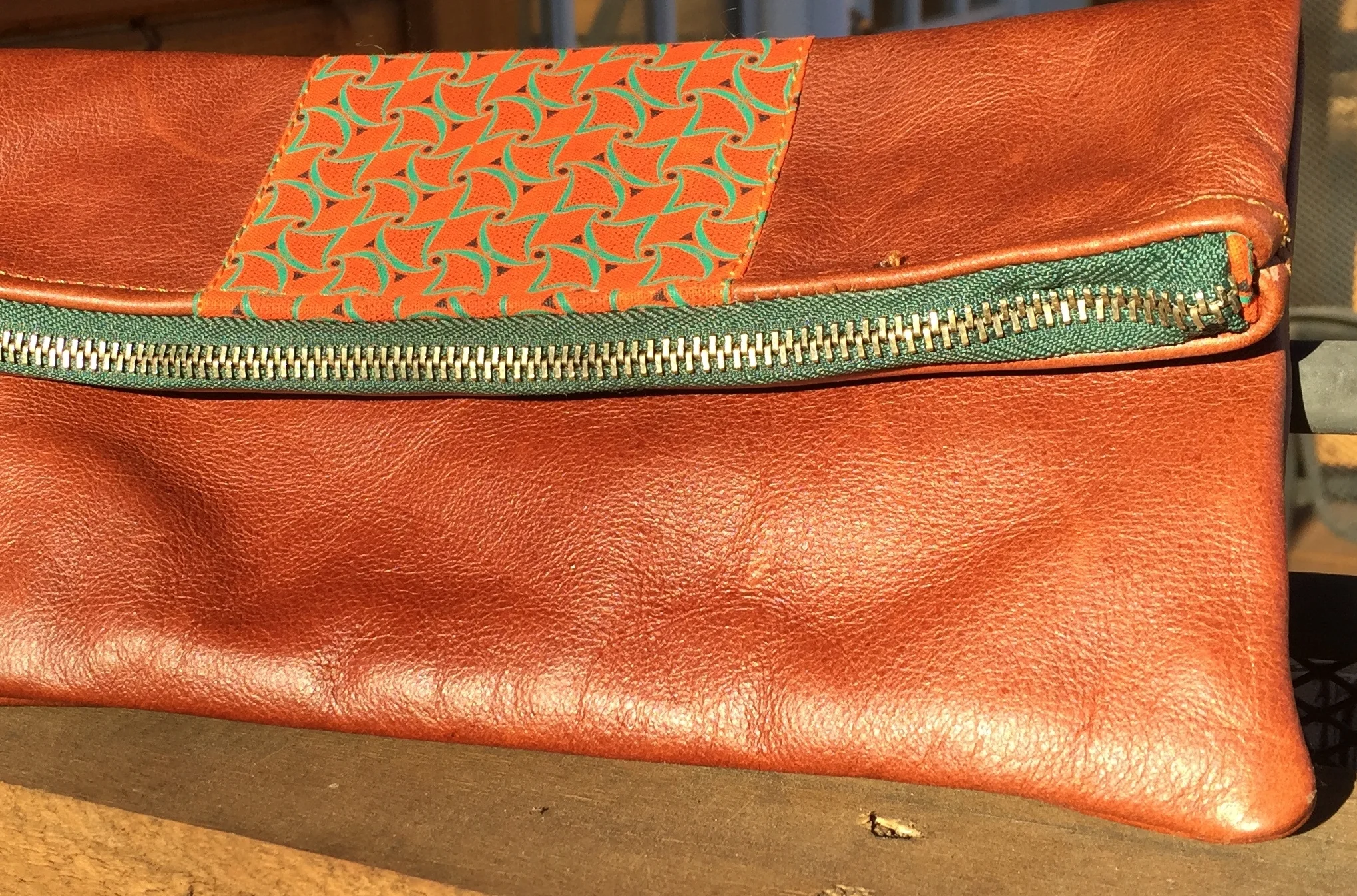 Tan foldover clutch with orange.jpg