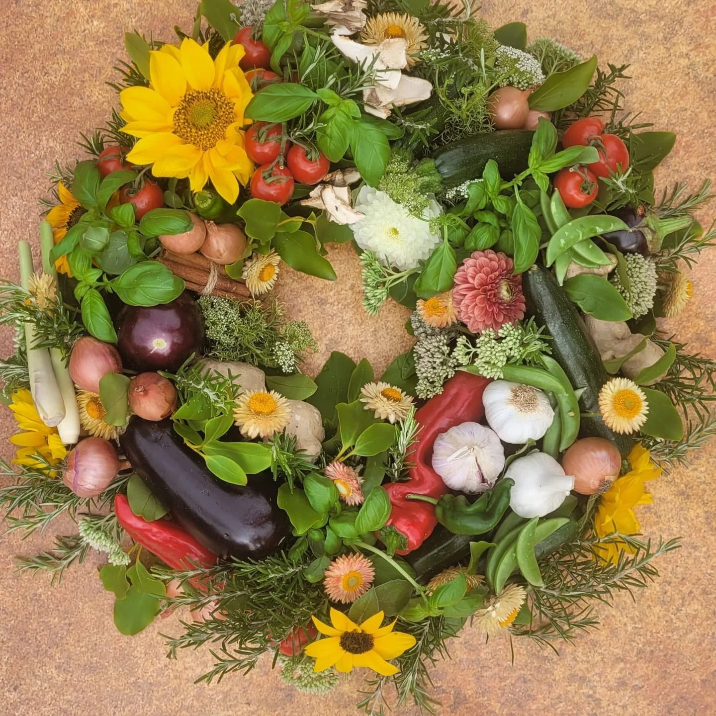 Farewell Flowers can be as personal as you want them to be, and this wreath was light on flowers to incorporate the many ingredients the deceased loved to cook with. I take great care over funeral tributes, and this one required extra delicacy to pre