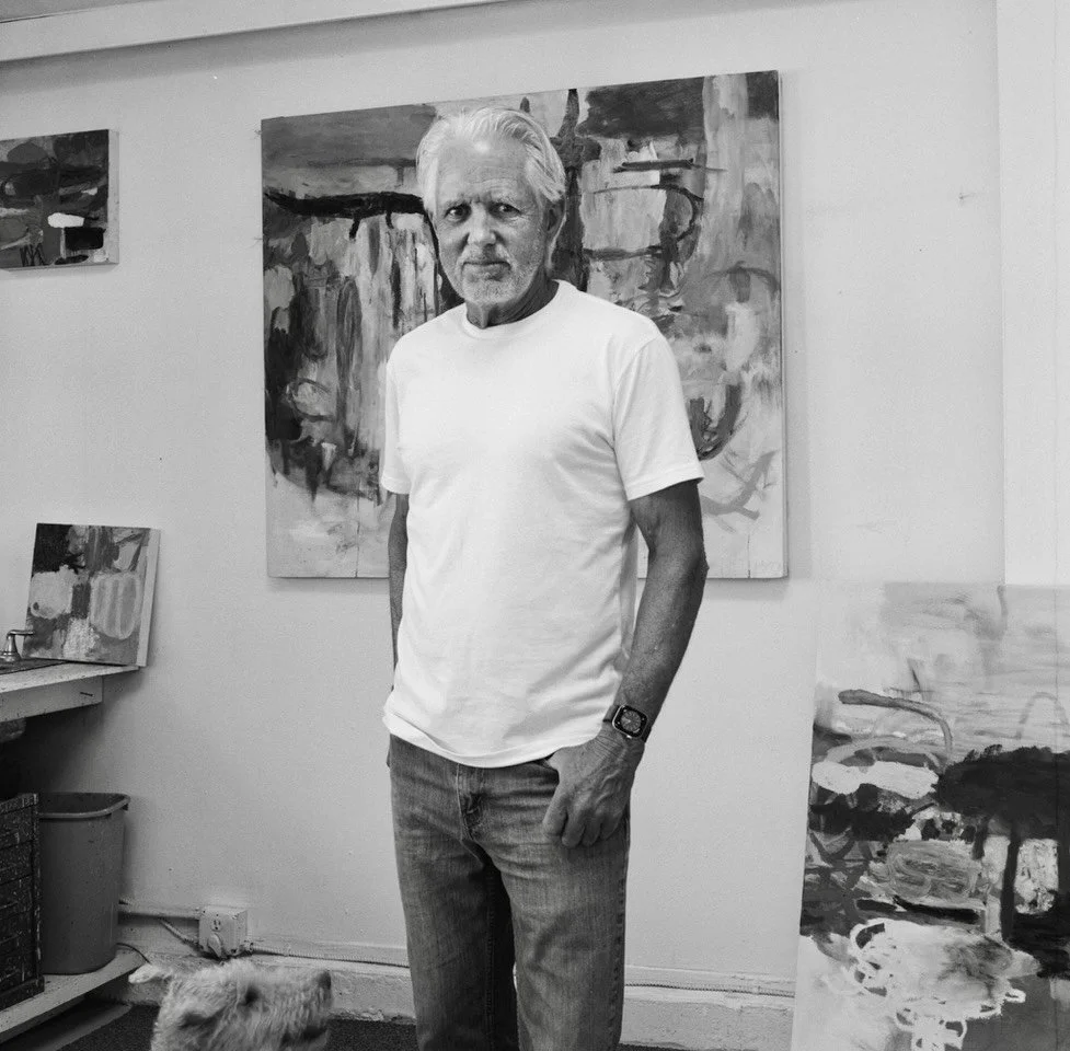 Artist Hugh Margerum standing in his studio