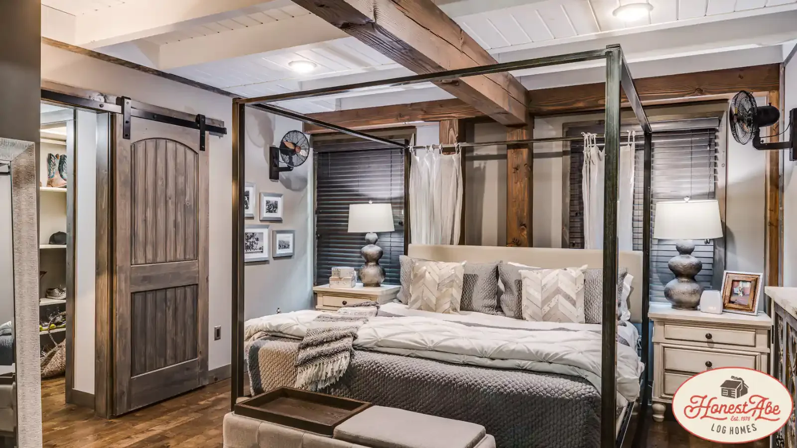 Gorgeous Exposed Beam Master Bedroom, custom interior sliding farm door closet, four poster bed by Honest Abe Log Cabins, financing by BuildBuyRefi.com Construction Loan Division.