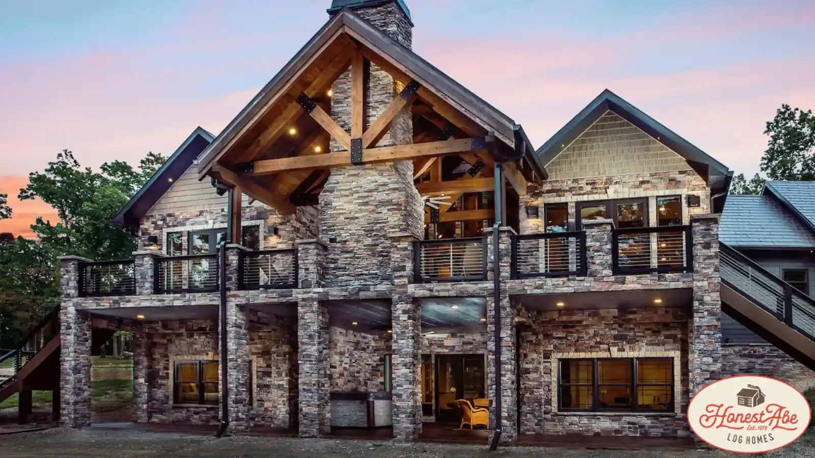 Exquisite Timber Frame and Stone Home, Massive Stone fireplace, symmetrical design, large deck out door covered vaulted porch, designed by Honest Abe Log Homes with up to 100% financing by BuildBuyRefi.com