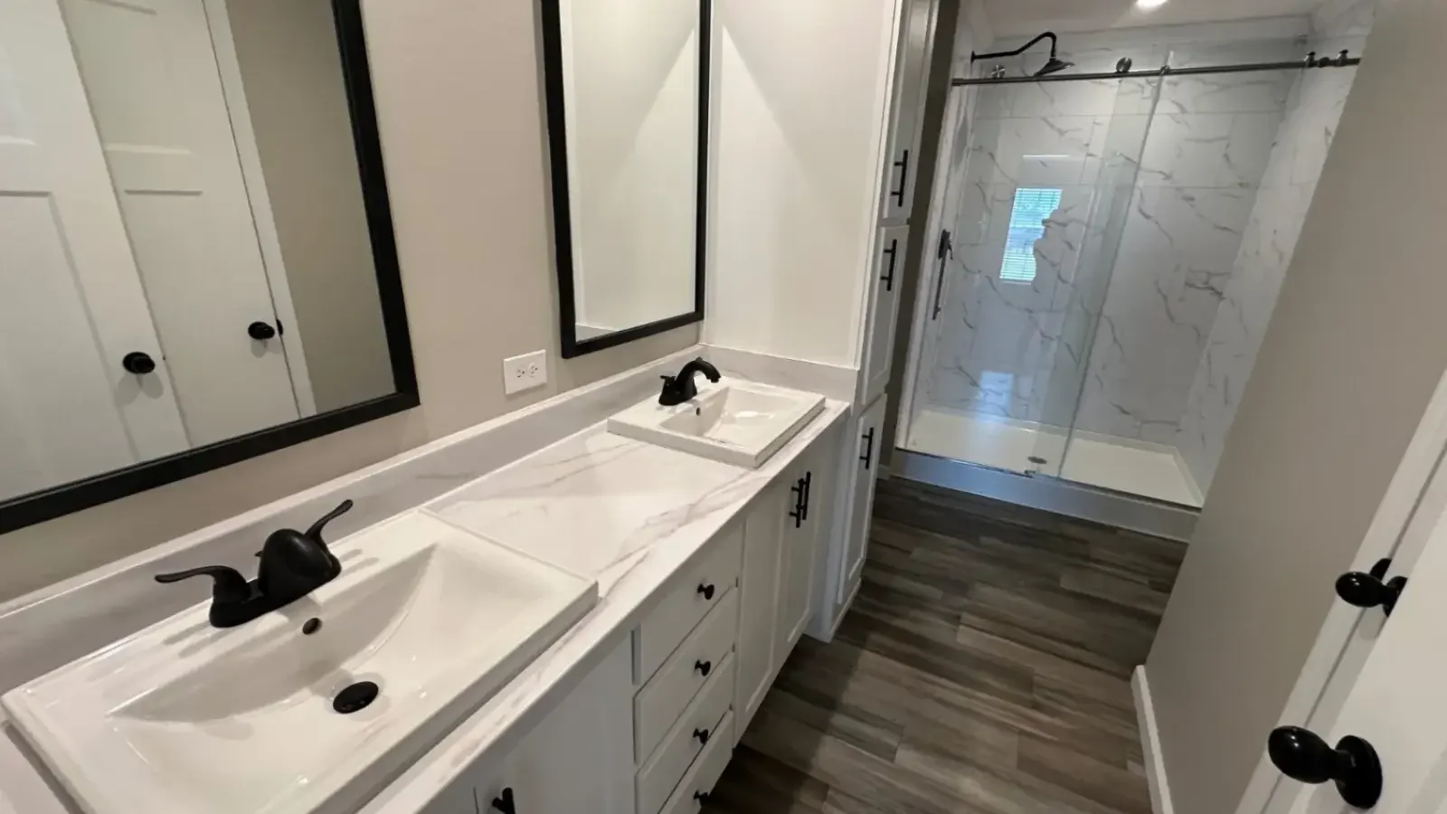 Custom Master Bath, marble counters, dual sinks, gorgeous sliding glass door walk-in shower with full tile floor to ceiling by Suncrest Homes Florida and built by Refi Home Loans.